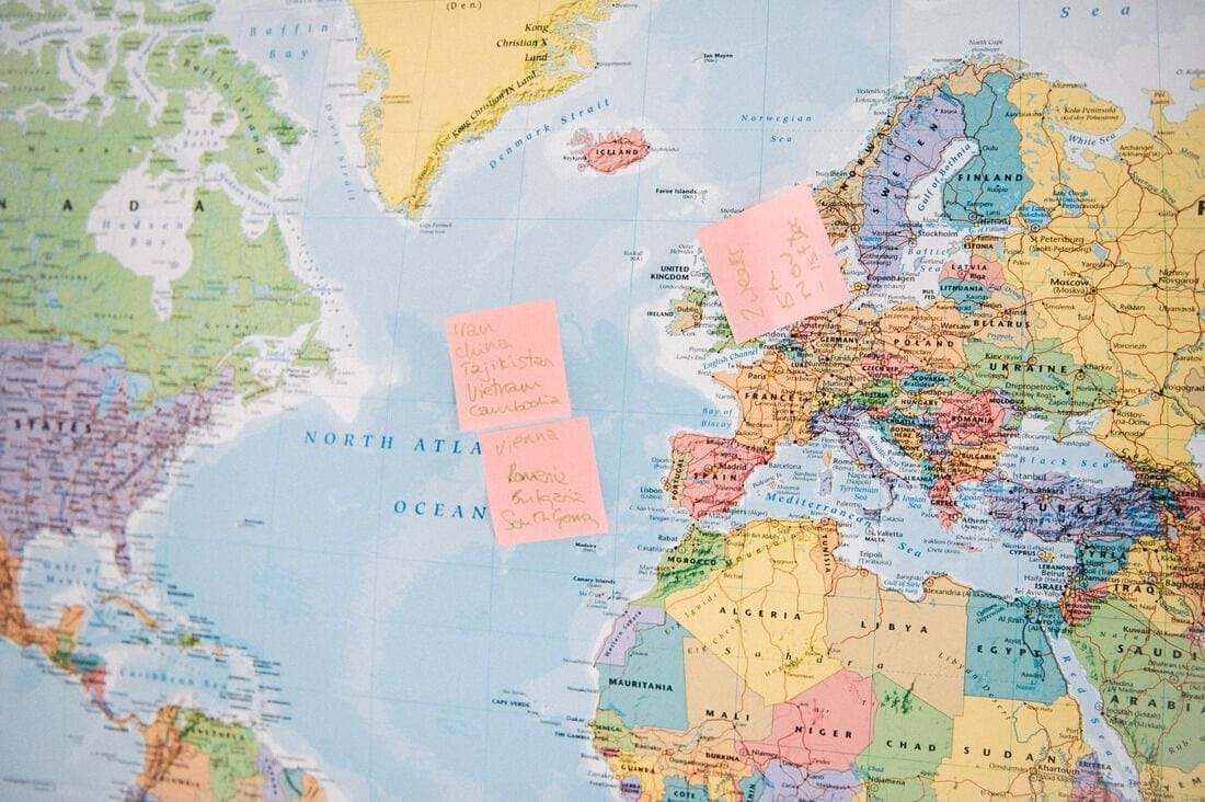 a world map with post it notes