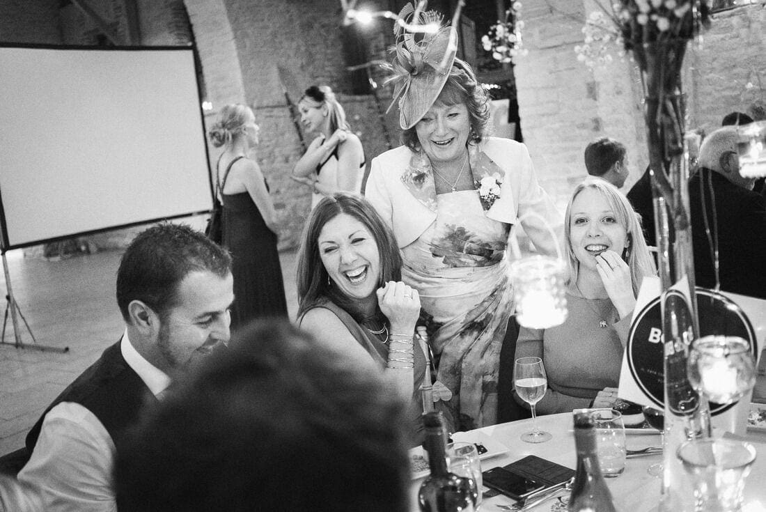 wedding guests enjoy a joke