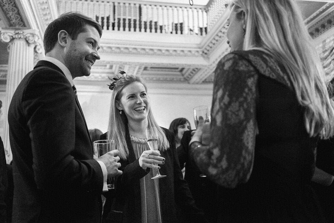 wedding guests share a joke