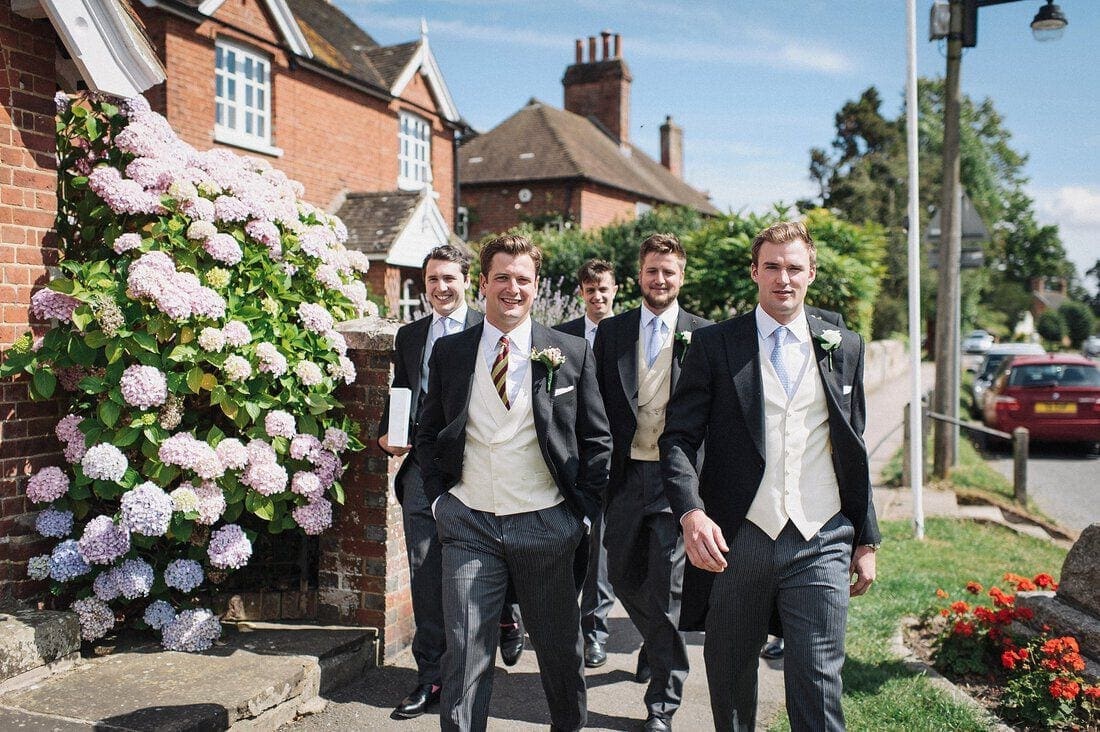 groom and his ushers arrive at church
