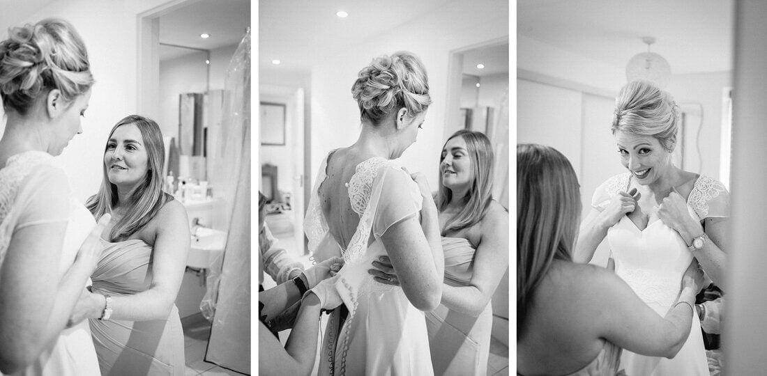 putting on the wedding dress