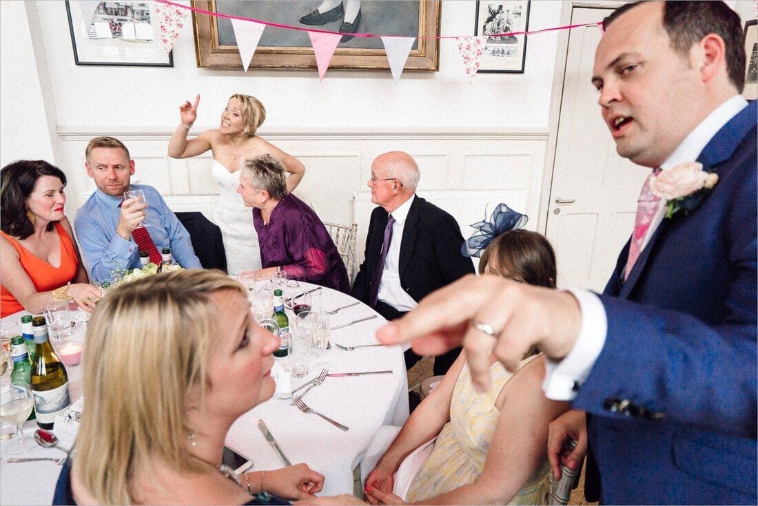 the bride and groom chat with guests