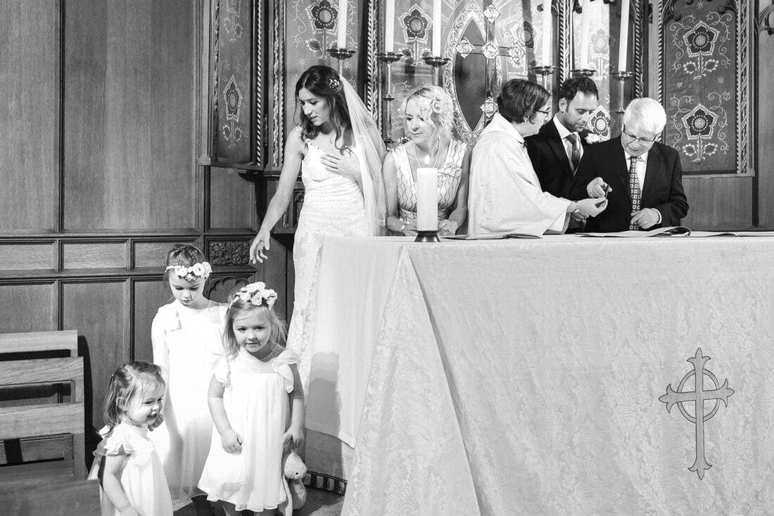 married couple sign the wedding register