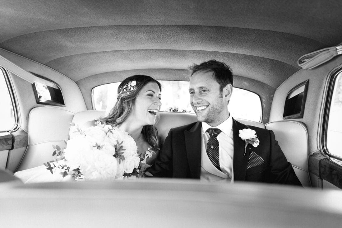 bride and groom arrive by car at syon park