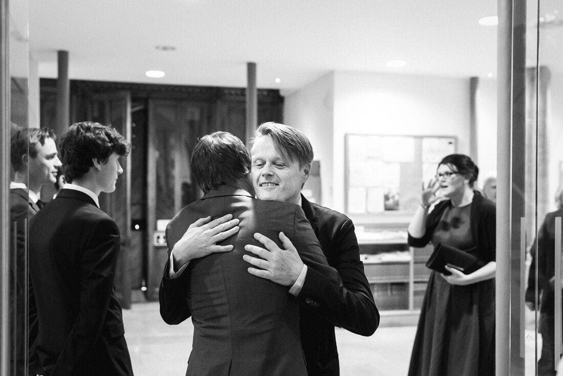 groom greeting the wedding guests