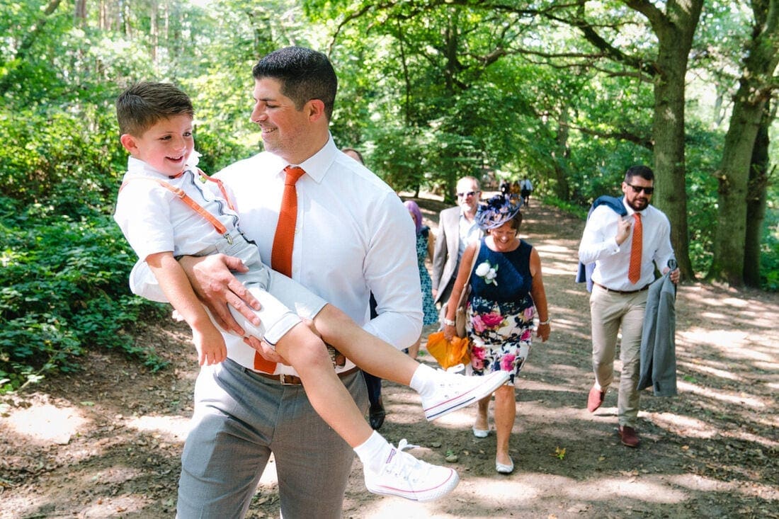 groom and his son walking to the wedding ceremony