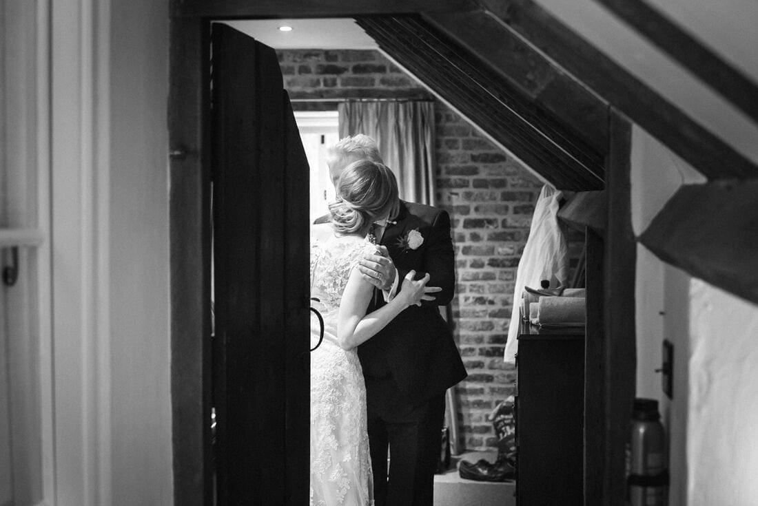 bride and her father have a moment before the wedding day begins