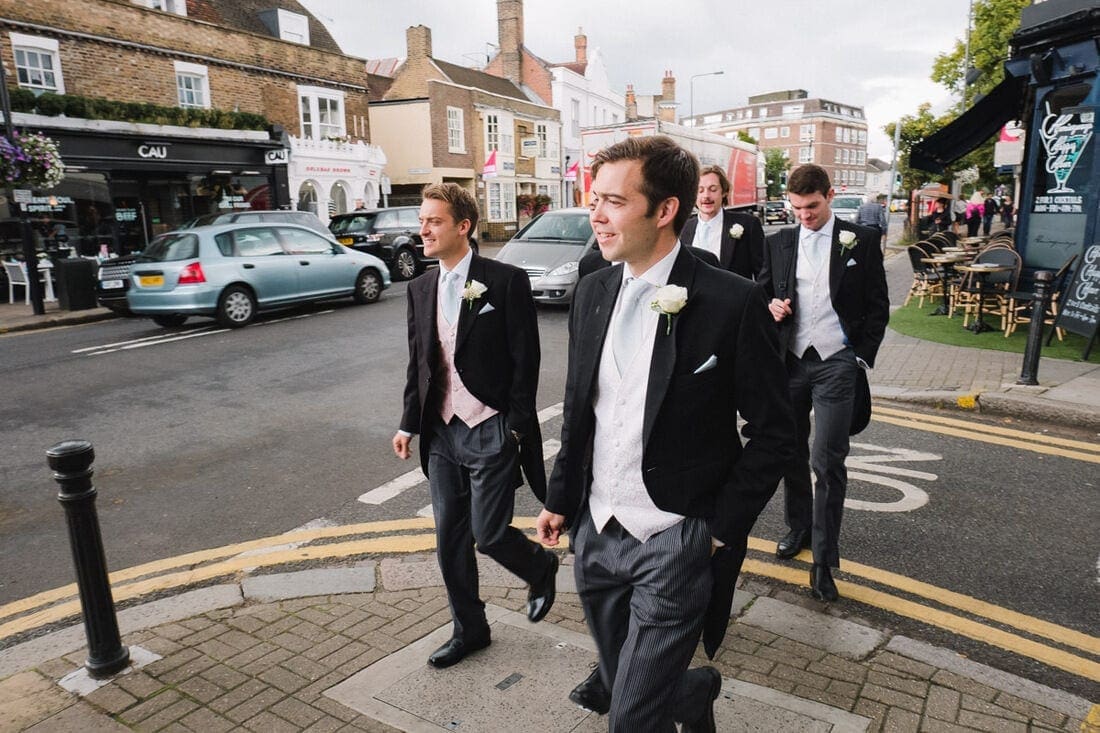 groom and ushers make their way to church