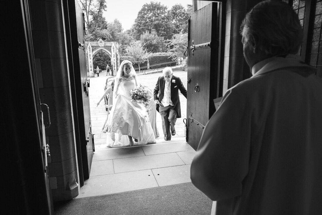 the bride arrives for her ceremony at the sacred heart wimbledon