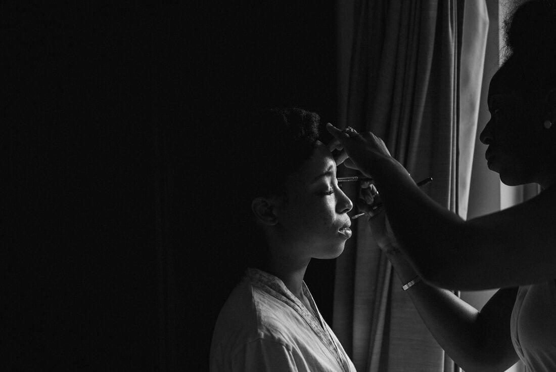 the bride having her makeup done