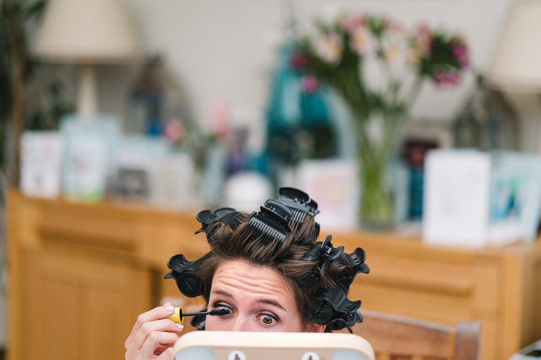 the bride doing her makeup