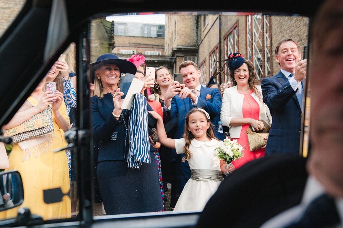 wedding guests and family taking selfies