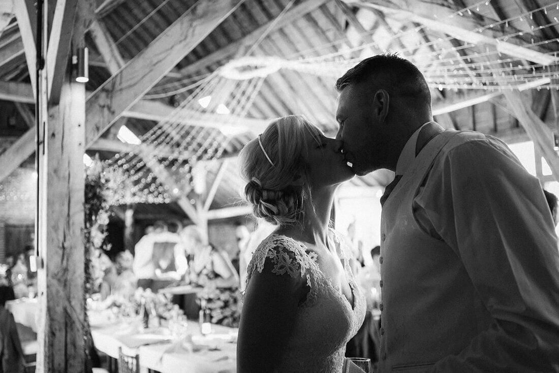 a kiss between husband and wife on their wedding day