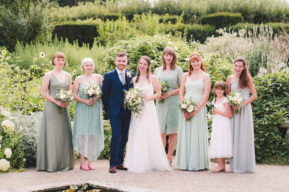 wedding group photo in the gardens at Loseley Park