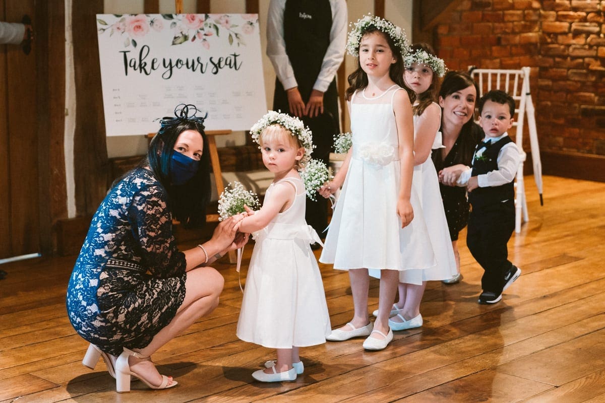 I love photographing such adorable reactions as these when the flower girls saw the bride for the first time at Cain Manor