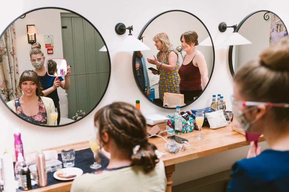 the bride and bridesmaids getting ready at Gate Street Barn