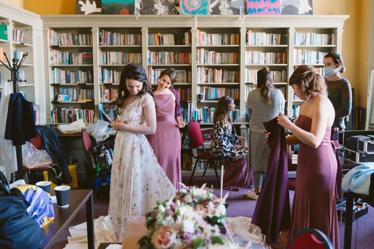 bride and bridesmaids getting ready