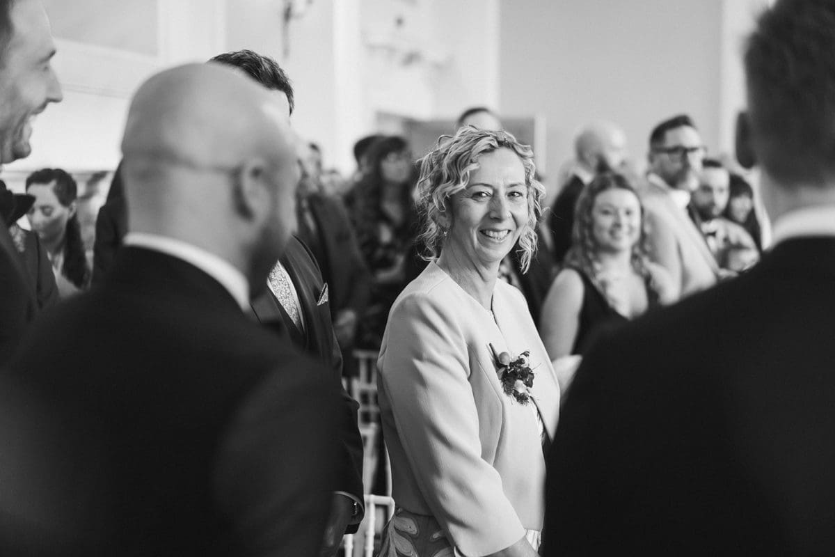 mother of the groom photographed during the wedding ceremony in Surrey