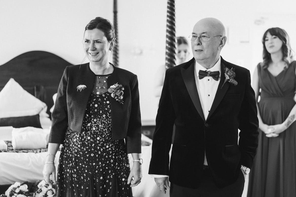 proud mum and dad of bride on her wedding day