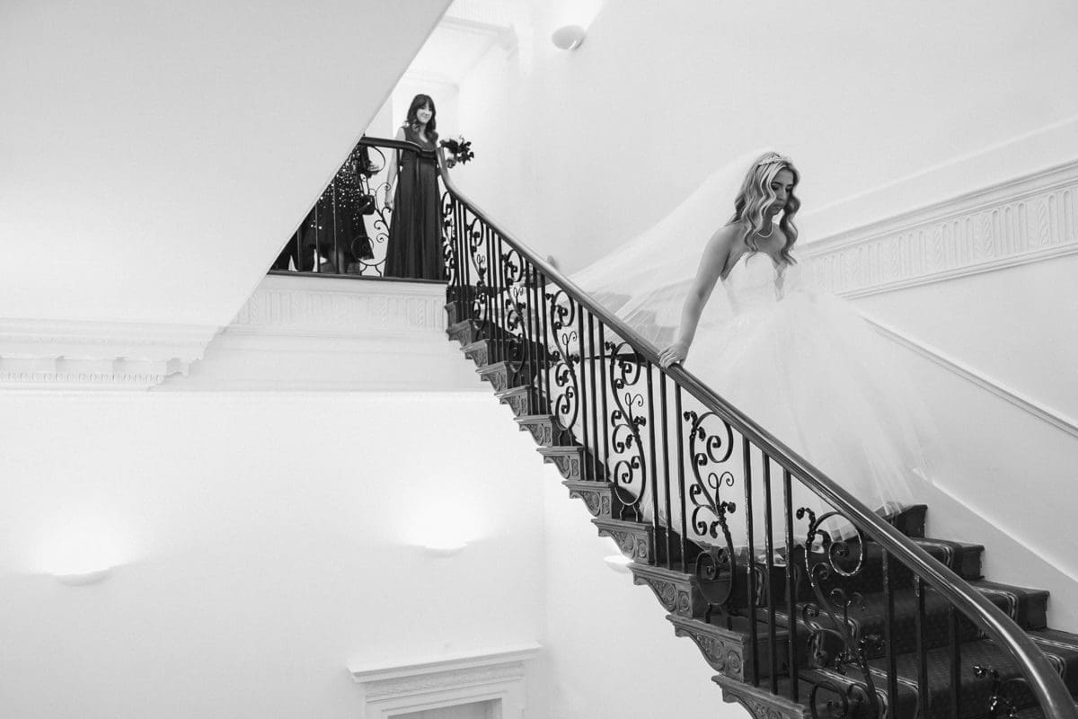 the bride arrives for her wedding ceremony at Botleys Mansion