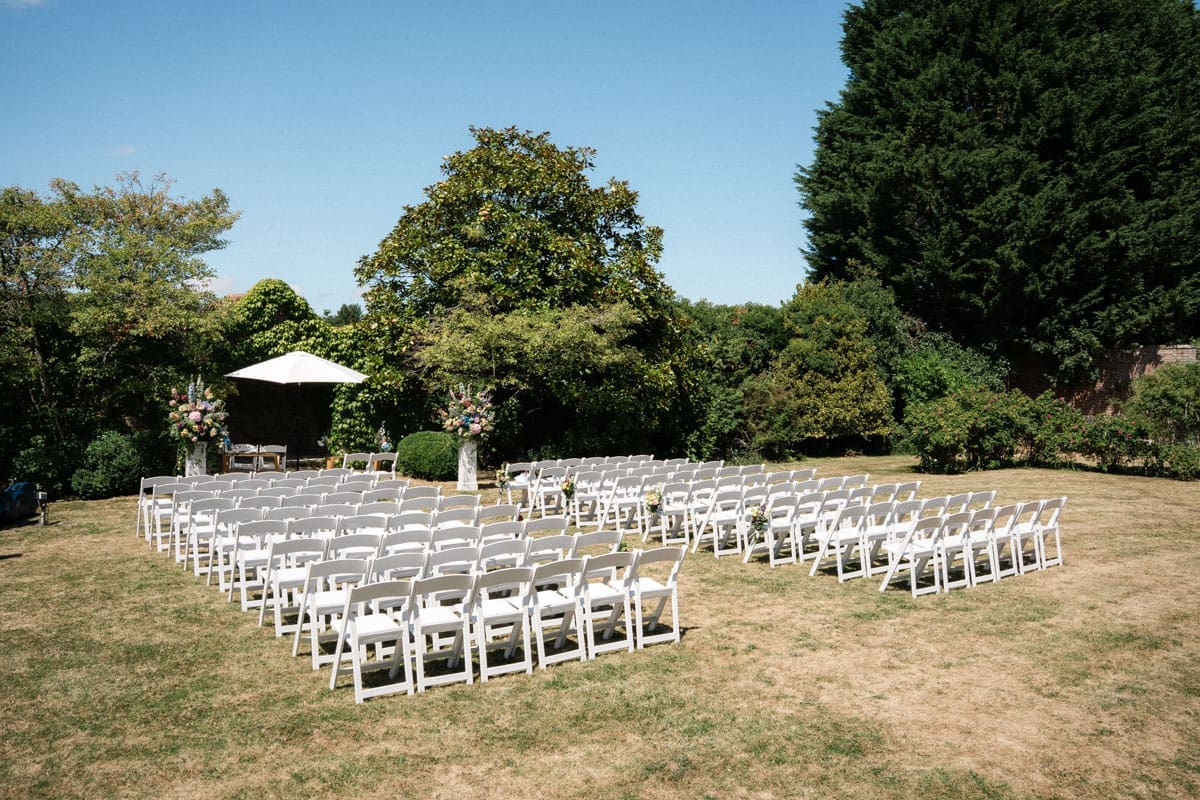 Outdoor wedding ceremony setup in the garden at Notley Abbey