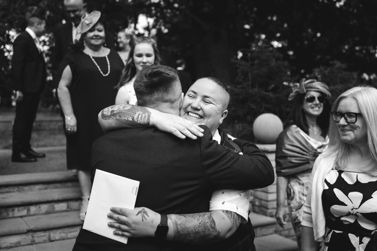 wedding guests greet the groom at Pembroke Lodge