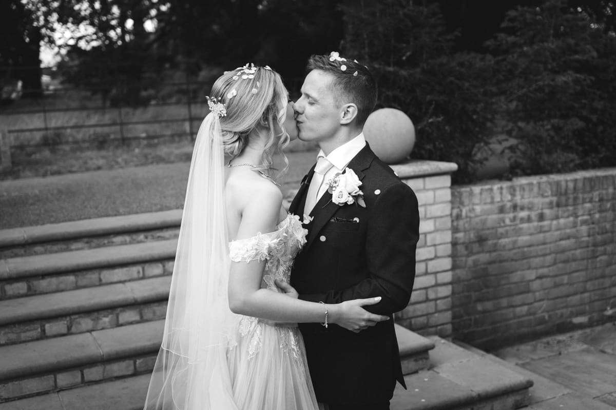 a kiss as husband and wife after the confetti