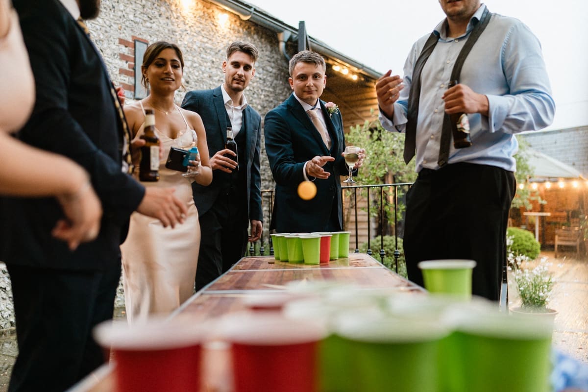 beer pong at a wedding at Upwaltham Barns