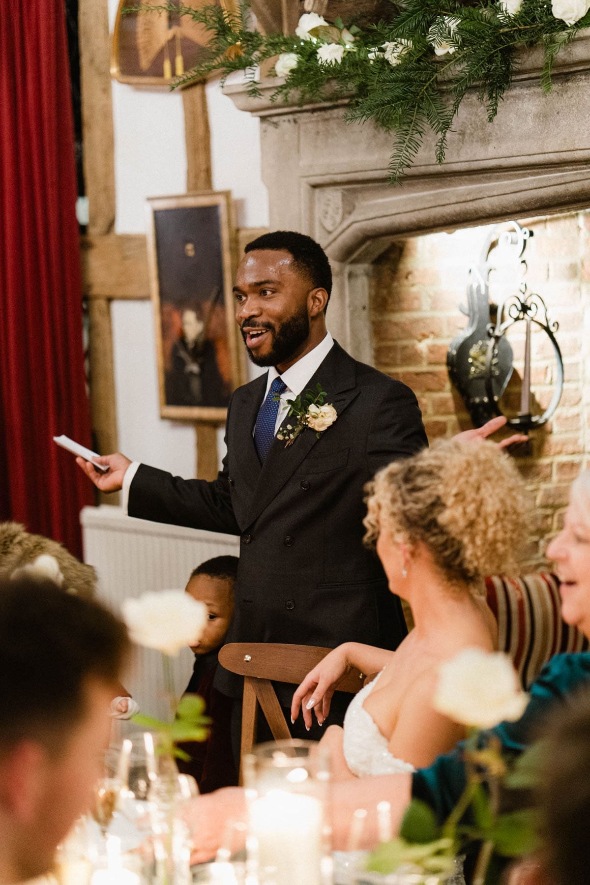 groom delivers his speech at his winter wedding